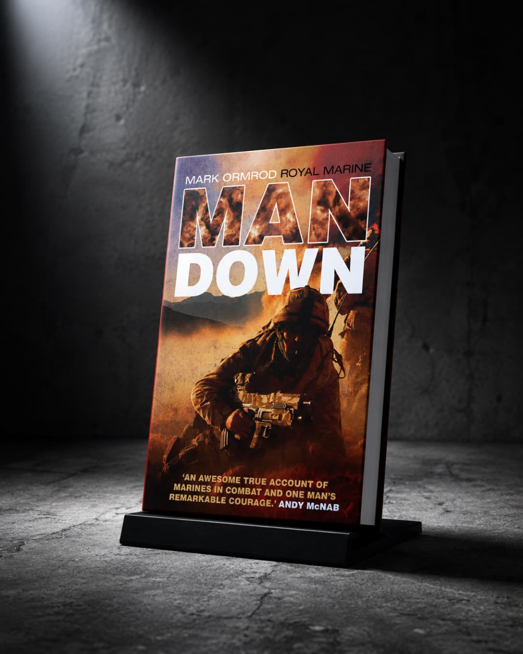 Man Down book cover — Mark Ormrod, Royal Marine, over a battlefield scene, with a quote from Andy McNab